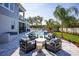 Backyard features a pristine pool, modern lounge furniture, and a well-manicured lawn, creating an ideal outdoor oasis at 3126 Wolf Lake Ave, Apopka, FL 32712