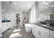 Luxurious bathroom featuring soaking tub, dual vanities, and elegant tile work at 3126 Wolf Lake Ave, Apopka, FL 32712
