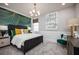 Chic bedroom featuring a statement green accent wall and stylish decor at 3126 Wolf Lake Ave, Apopka, FL 32712
