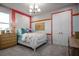 Cozy bedroom with colorful accents, textured wall panel, and a contemporary aesthetic at 3126 Wolf Lake Ave, Apopka, FL 32712