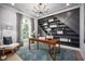 Stylish home office featuring custom built-in shelving and ample natural light at 3126 Wolf Lake Ave, Apopka, FL 32712