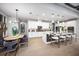 This spacious kitchen features white cabinets, a central island with seating, and modern appliances at 3126 Wolf Lake Ave, Apopka, FL 32712