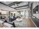 Open-concept living area boasts stylish decor, modern lighting, and seamless flow to kitchen and dining at 3126 Wolf Lake Ave, Apopka, FL 32712