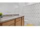 Bathroom with a granite-topped vanity and a shower with geometric pattern at 3280 Canna Lily Pl, Clermont, FL 34711