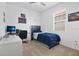bedroom with a blue bed, desk, and themed decor at 3280 Canna Lily Pl, Clermont, FL 34711