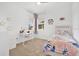 Bright bedroom with desk area and large windows at 3280 Canna Lily Pl, Clermont, FL 34711