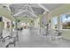 A stylish and comfortable clubhouse lounge area with plenty of seating and a bar for socializing at 3280 Canna Lily Pl, Clermont, FL 34711