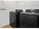 Modern laundry room featuring new Samsung washer and dryer and ample storage at 3280 Canna Lily Pl, Clermont, FL 34711