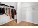 Walk-in closet with ample hanging space and carpeting at 3280 Canna Lily Pl, Clermont, FL 34711