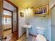 Neat bathroom features a shower, sink, and toilet with decorative accents in a well-lit space at 3443 S Mellonville Ave, Sanford, FL 32773