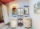 Charming bathroom with double vanity sinks, vintage-style mirrors, and tiled flooring at 3443 S Mellonville Ave, Sanford, FL 32773