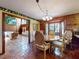 Cozy breakfast nook with tiled floors, views of the living room, and ample natural light at 3443 S Mellonville Ave, Sanford, FL 32773