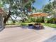 Inviting outdoor deck offers waterfront views, a picnic table, and seating at 3443 S Mellonville Ave, Sanford, FL 32773