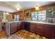 Well-appointed kitchen with custom cabinetry, granite countertops, and view to the breakfast nook at 3443 S Mellonville Ave, Sanford, FL 32773