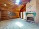 Bright living room featuring a brick fireplace, wood-paneled walls, and carpet flooring at 3443 S Mellonville Ave, Sanford, FL 32773