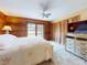 Cozy main bedroom boasts a calming interior, with wooden accents, ample closet space, and access to the outdoors at 3443 S Mellonville Ave, Sanford, FL 32773