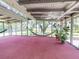 Relaxing screened porch with a hammock, plants, and views of the outside at 3443 S Mellonville Ave, Sanford, FL 32773