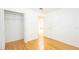 Bedroom with hardwood floors and a spacious closet for ample storage at 4236 Newtonhall Dr, Orlando, FL 32826