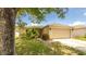 Single-Gathering home featuring a well-maintained lawn, landscaping, and a two-car garage at 4236 Newtonhall Dr, Orlando, FL 32826