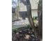Landscaped backyard view with patio and exterior screened-in porch at 460 Sand Lime Rd, Winter Garden, FL 34787