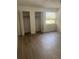 Bedroom featuring laminate flooring, natural light, and closet space at 460 Sand Lime Rd, Winter Garden, FL 34787