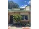 Two-story home featuring neutral color scheme, wrought iron door, and well-maintained landscaping at 460 Sand Lime Rd, Winter Garden, FL 34787