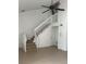 Open living area featuring staircase, ceiling fan, and tile flooring at 460 Sand Lime Rd, Winter Garden, FL 34787