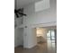 Open living area featuring high ceiling, tile flooring, and access to patio at 460 Sand Lime Rd, Winter Garden, FL 34787