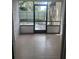 Enclosed patio with tile flooring, screen door, and views of the outdoor space at 460 Sand Lime Rd, Winter Garden, FL 34787