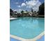 Exterior view of the community pool with lounge chairs and clear blue water at 460 Sand Lime Rd, Winter Garden, FL 34787