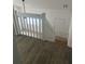 Upstairs view of staircase featuring wood flooring and railing at 460 Sand Lime Rd, Winter Garden, FL 34787