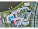 Aerial view of the community pools, lazy river, splash pad, and surrounding amenities at 4740 Sleepy Hollow Dr, Kissimmee, FL 34746