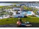 Aerial view of a resort-style community with pool, lazy river, pier and kayak rentals at 4740 Sleepy Hollow Dr, Kissimmee, FL 34746