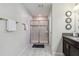 Bathroom featuring a glass shower, tile floors, wall decor and plenty of towel space at 4740 Sleepy Hollow Dr, Kissimmee, FL 34746