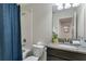 Bathroom with tub and shower combo, decorative mirror, and neutral colored walls at 4740 Sleepy Hollow Dr, Kissimmee, FL 34746