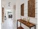 Bright hallway with unique decor, marble tile floors, and a staircase leading to the upper level at 4740 Sleepy Hollow Dr, Kissimmee, FL 34746