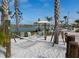 Relaxing hammock area with seating, sandy ground, and shady trees in the community at 4740 Sleepy Hollow Dr, Kissimmee, FL 34746