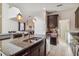 Beautiful kitchen with granite countertops, stainless steel appliances, and view to living area at 4740 Sleepy Hollow Dr, Kissimmee, FL 34746
