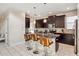 Modern kitchen with granite countertops, stainless steel appliances, and stylish breakfast bar seating at 4740 Sleepy Hollow Dr, Kissimmee, FL 34746