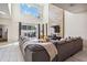 Spacious living room with two-story ceilings, a TV, and access to the outdoor patio area at 4740 Sleepy Hollow Dr, Kissimmee, FL 34746