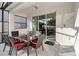 Outdoor patio seating area with table and chairs, leading to sliding glass doors at 4740 Sleepy Hollow Dr, Kissimmee, FL 34746