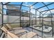 Relaxing screened-in pool and spa area with lounge chairs for enjoying the sun at 4740 Sleepy Hollow Dr, Kissimmee, FL 34746