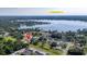 An aerial view showcases the neighborhood and nearby Bear Lake at 6198 Linneal Beach Dr, Apopka, FL 32703
