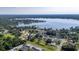 An aerial view showcases the neighborhood and nearby Bear Lake at 6198 Linneal Beach Dr, Apopka, FL 32703