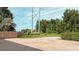 Open backyard features a private fence, concrete patio, lawn, and mature trees and shrubs at 6198 Linneal Beach Dr, Apopka, FL 32703