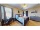 Bright bedroom featuring a ceiling fan, desk area and large dresser at 6198 Linneal Beach Dr, Apopka, FL 32703