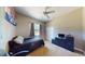 Bedroom with a dark bed, ceiling fan and window at 6198 Linneal Beach Dr, Apopka, FL 32703