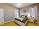 Comfortable bedroom featuring a backyard view and neutral colors at 6198 Linneal Beach Dr, Apopka, FL 32703