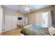 Bright bedroom with closet, en-suite bathroom, vanity area and backyard access at 6198 Linneal Beach Dr, Apopka, FL 32703