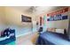 Bedroom with a dark bed, ceiling fan and window at 6198 Linneal Beach Dr, Apopka, FL 32703